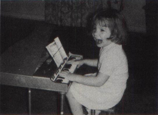 A young Lee playing the piano.